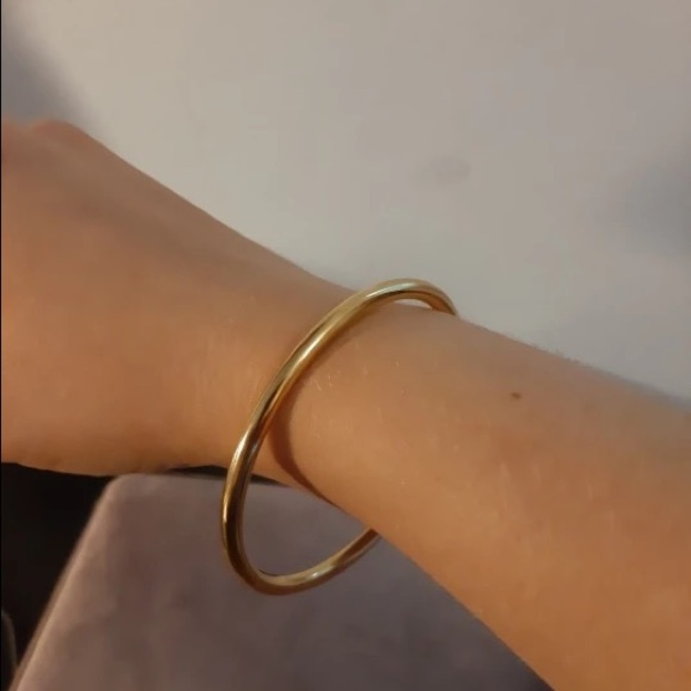 Gold stainless steel bangle.